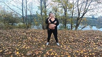 A Stunning Milf Enjoys Some Public Boob Play By A Lake